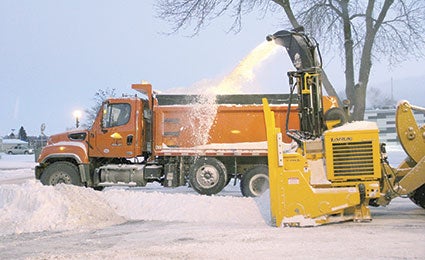 City crews plow out snow Monday morning in downtown Austin. Jason Schoonover/jason.schoonover@austindailyherald.com