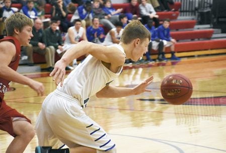 Brady Lester takes off down the court for Lyle-Pacelli in LeRoy Thursday. Rocky Hulne/sports@austindailyherald.com