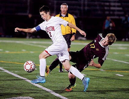 Austin’s Tucker Nelson steals the ball from Northfield’s Finn Muir in the second half of the Section 1A championship in Rochester this past October. Herald file photo