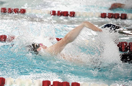 Kaleb Blaser swims the backstroke last December against Albert Lea. Herald file photo