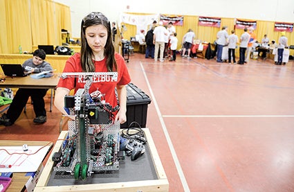 Southland student Ava Wilde works on her team’s robot Saturday Austin Public Schools and Riverland College Southern Minnesota VEX Robotic Competition. 