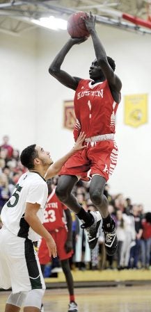 Austin’s Both Gach pulls up for a jumper in the lane in the first quarter Tuesday night agianst Faribault. Eric Johnson/photodesk@austindailyherald.com