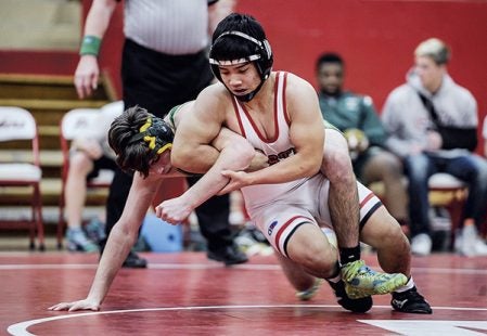 Austin’s Moo Thaw takes down Rochester Mayo’s Anton Plonka at 132 pounds Thursday in Ove Berven Gym. Eric Johnson/photodesk@austindailyherald.com