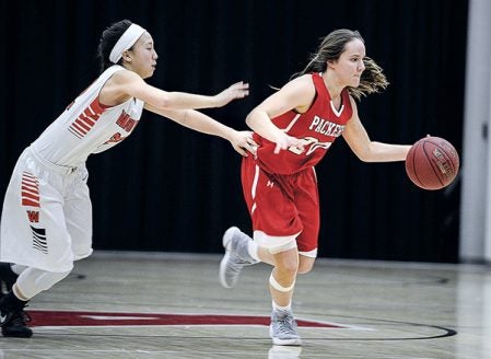 Ausitn’s Elyse Hebrink gets past Winona’s Selena Lor during the first half Friday night in Ove Berven Gym. Eric Johnson/photodesk@austindailyherald.com