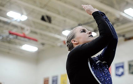 Austin Packer Dance Team’s Tressie Kinney readies for the start of APDT’s high kick routine Saturday during the Austin Packer Dance Team Show in Packer Gym. 