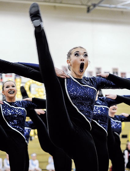 The Austin Packer Dance Team’s Maya Wuertz with the high kick squad Saturday during the Austin Packer Dance Team Show in Packer Gym. 