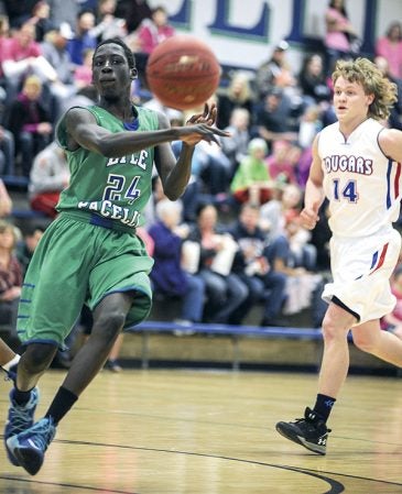 Lyle-Pacelli’s Kamis Kuku fires a pass off the top of the key during the second quarter against Mabel-Canton Friday night in Lyle. Eric Johnson/photodesk@austindailyherald.com