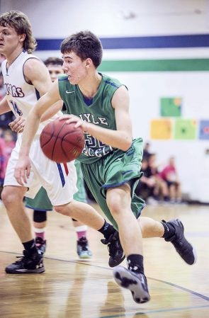 Lyle-Pacelli’s Jed Nelson breaks to the hoop during the second half against Mabel-Canton Friday night in Lyle. Eric Johnson/photodesk@austindailyherald.com