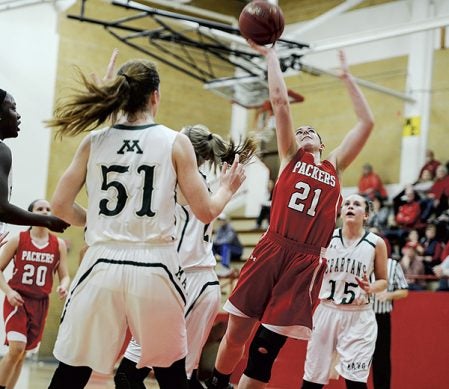 Austin’s Amber Hansen gets a lay-up through traffic against Rochester Mayo in the first half Tuesday night in Ove Berven Gym. Eric Johnson/photodesk@austindailyherald.com