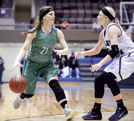 Lyle-Pacelli’s Abigail Bollingberg controls the ball against Grand Meadow’s Riley Queensland during the second half Tuesday night in the Section 1A West semifinals at Mayo Civic Center. Eric Johnson/photodesk@austindailyherald.com