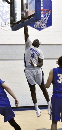 Sam Kuany goes up for a lay-up in Riverland Gym Wednesday. Rocky Hulne/sports@austindailyherald.com