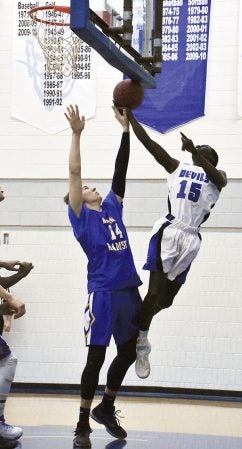 Mark Manyuon of Riverland attacks the rim against Kevin Schramm of Anoka-Ramsey in Riverland Gym Wednesday. Rocky Hulne/sports@austindailyherald.com