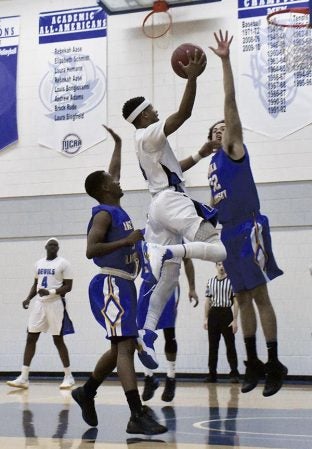 Riverland’s Junior Stone attacks the hoop against Anoka-Ramsey in Riverland Gym Wednesday. Rocky Hulne/sports@austindailyherald.com