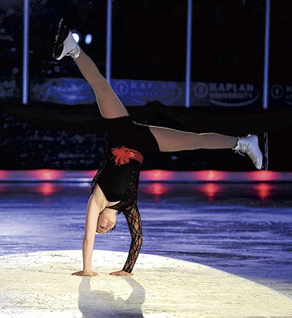 Ingrid Dolan Peterson cartwheels into her portion of an “Annie” medley. 