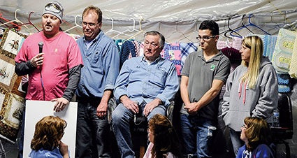 Dave Yerhart talks about his own personal fight with cancer during the Lyle Area Cancer Auction this past January. Herald file photo