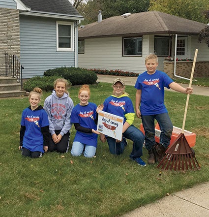 Members of the Enterprise 4-H Club take part in Day of Caring.