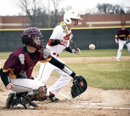 Austin’s Forrest Lewis takes off for first base as a wild pitch gets past Brady Herman against Stewartville in Dick Seltz Field Tuesday. Rocky Hulne/sports@austindailyherald.com