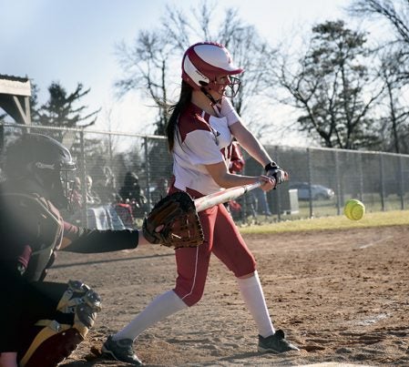 Justine Reimers takes a swing for the Austin softball team against Northfield in Todd Park Thursday. Rocky Hulne/sports@austindailyherald.com