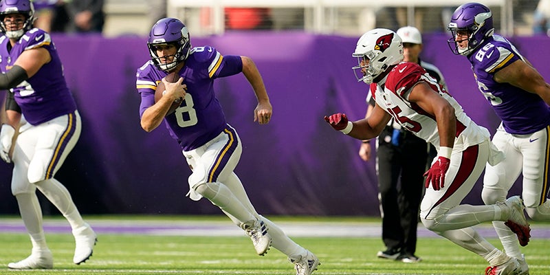 Minnesota Vikings quarterback Kirk Cousins takes the field before