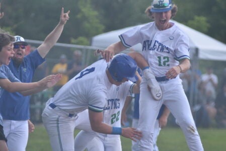 Lyle-Pacelli's Landon Meyer trots home to score the game-winning run. Rocky Hulne/sports@austindailyherald.com